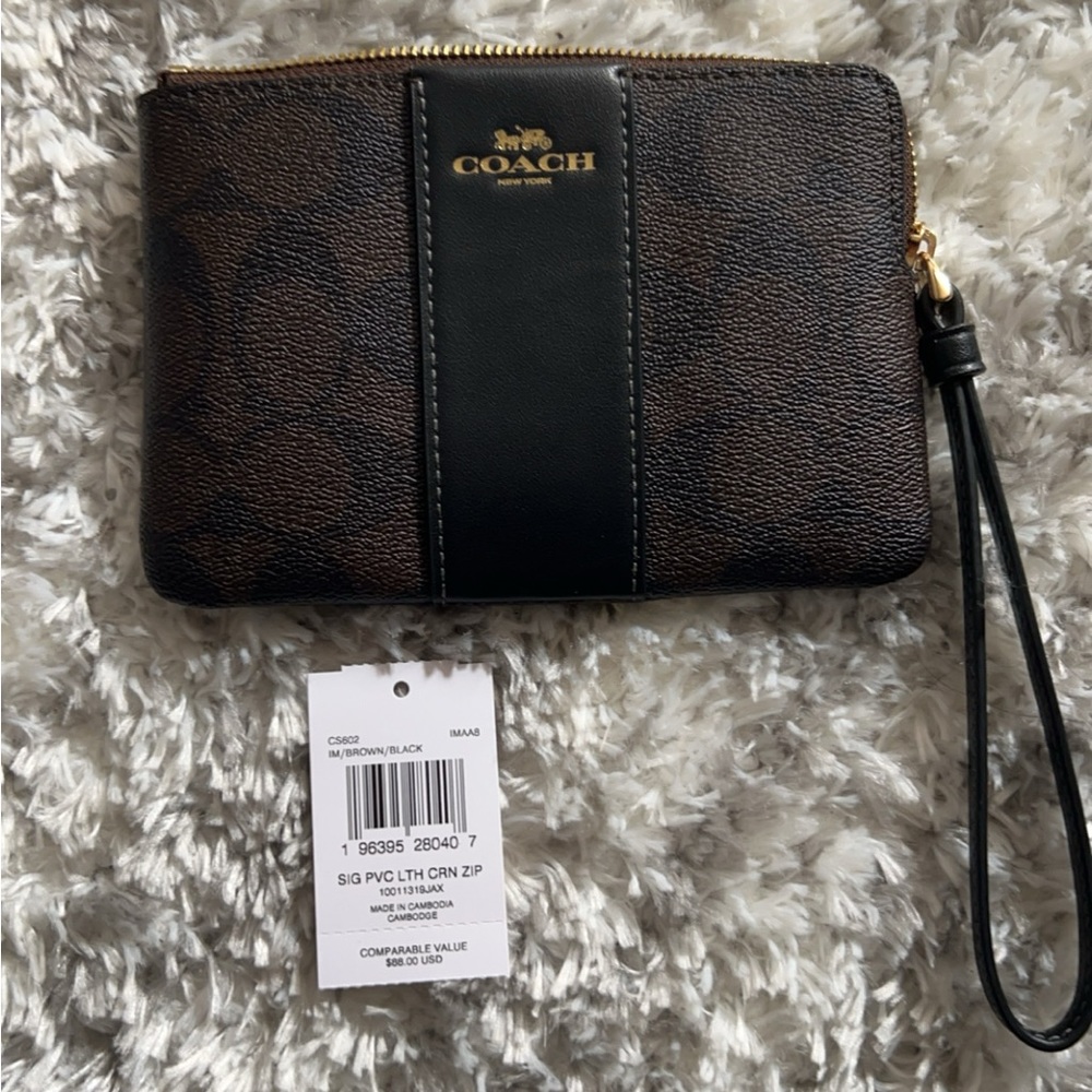 Coach brown leather wristlet.